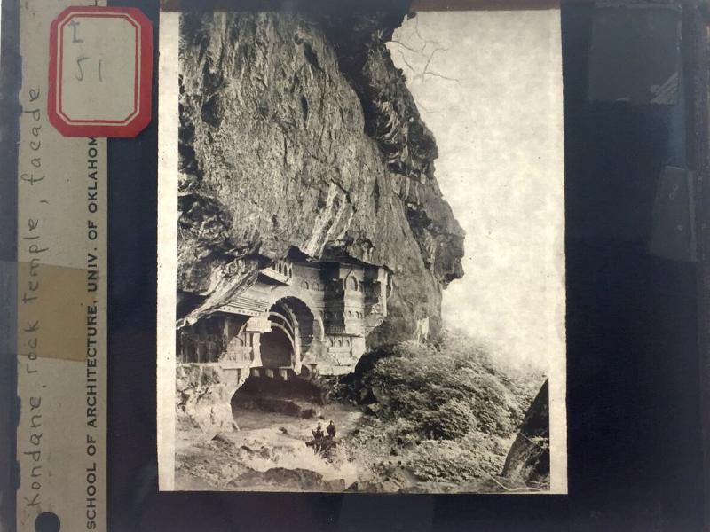 A photograph of a temple set in a cliff