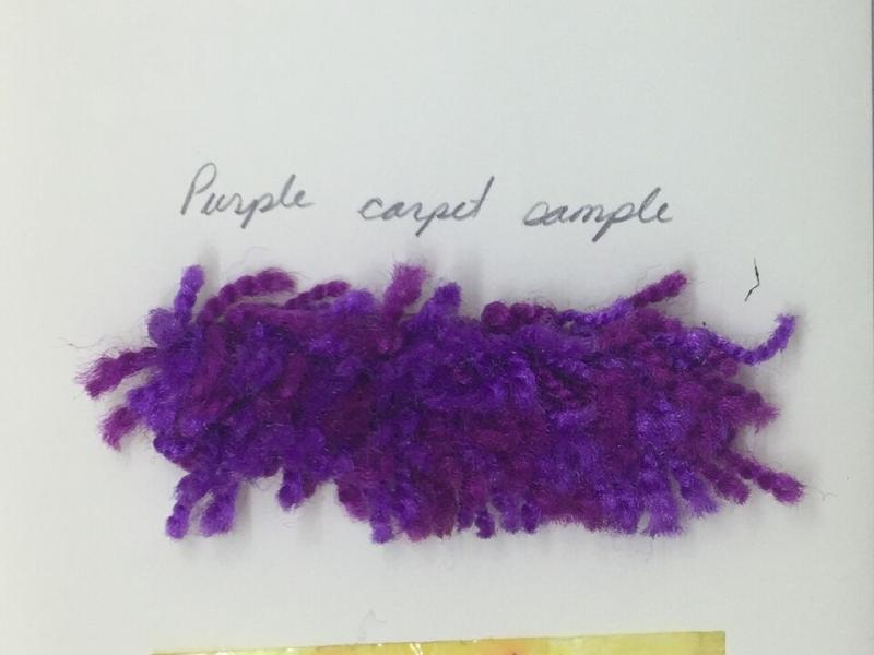 A photograph of a purple carpet sample