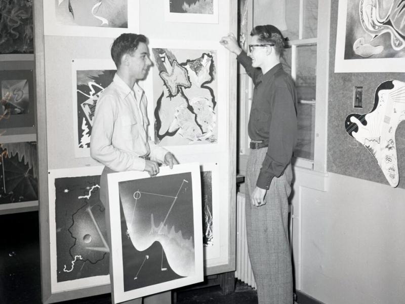 Two students discussing student work