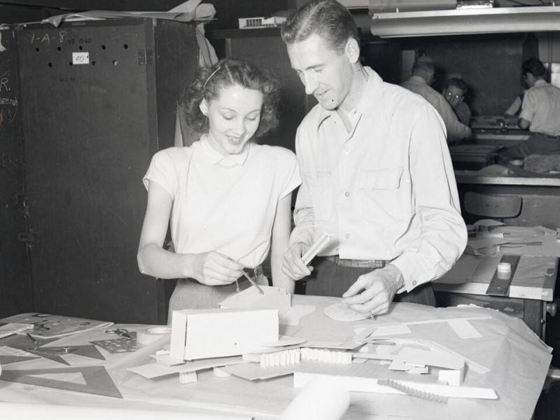 Two students working on a model
